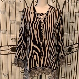 Tunic blouse with lace up neck line